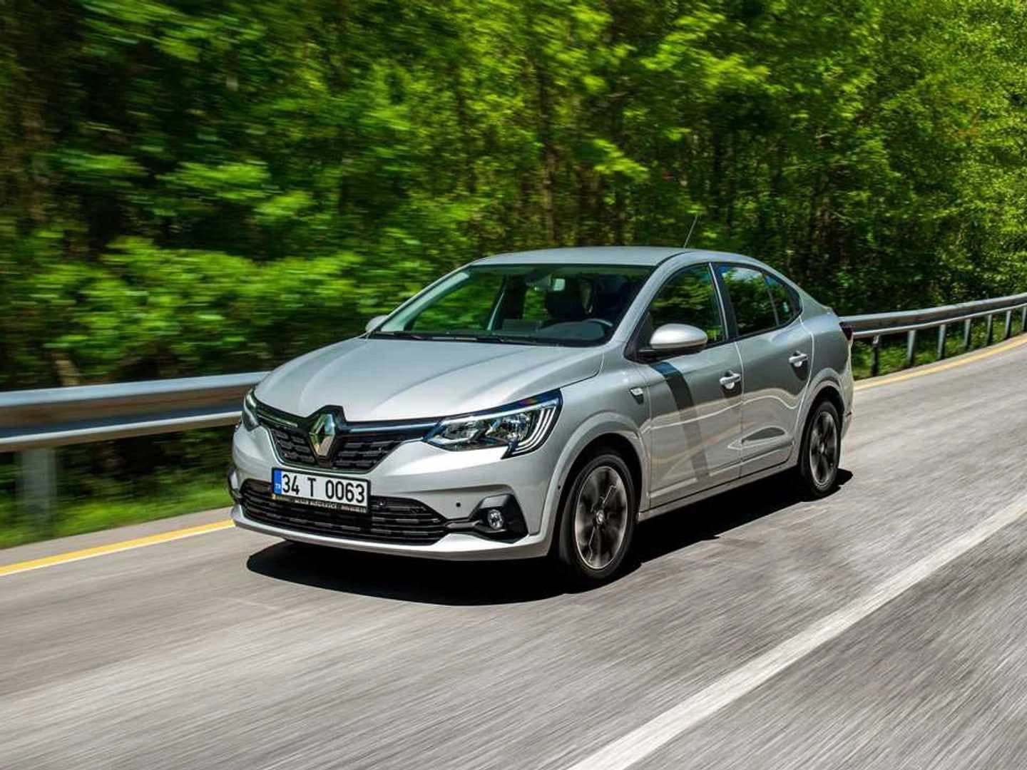 Renault Taliant rental car driving on a coastal road near Alanya